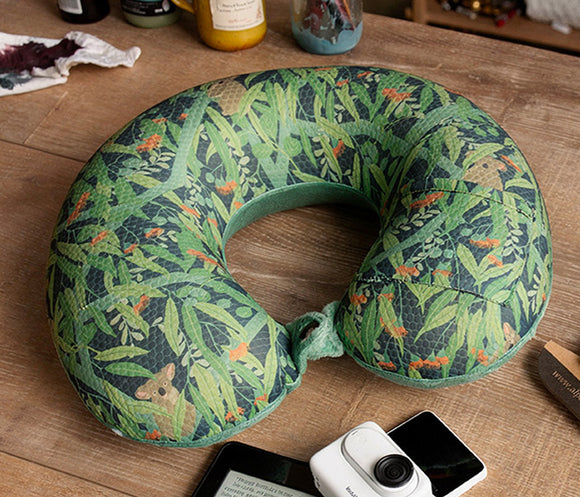 Memory Foam travel Pillow with Koala print sitting on a table