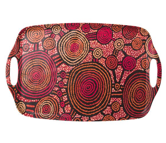 A rectangular bamboo/melamine serving tray with integrated side handles, featuring Aboriginal artwork by Teddy Gibson from Warlukurlangu Artists. Image on a white background.