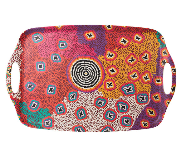A rectangular bamboo/melamine serving tray with integrated side handles, featuring Aboriginal artwork byRuth Stewart from Warlukurlangu Artists. Image on a white background.