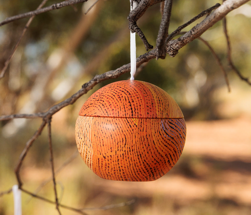 Susan Peters Aboriginal art Christmas Bauble Tin hanging from a tree